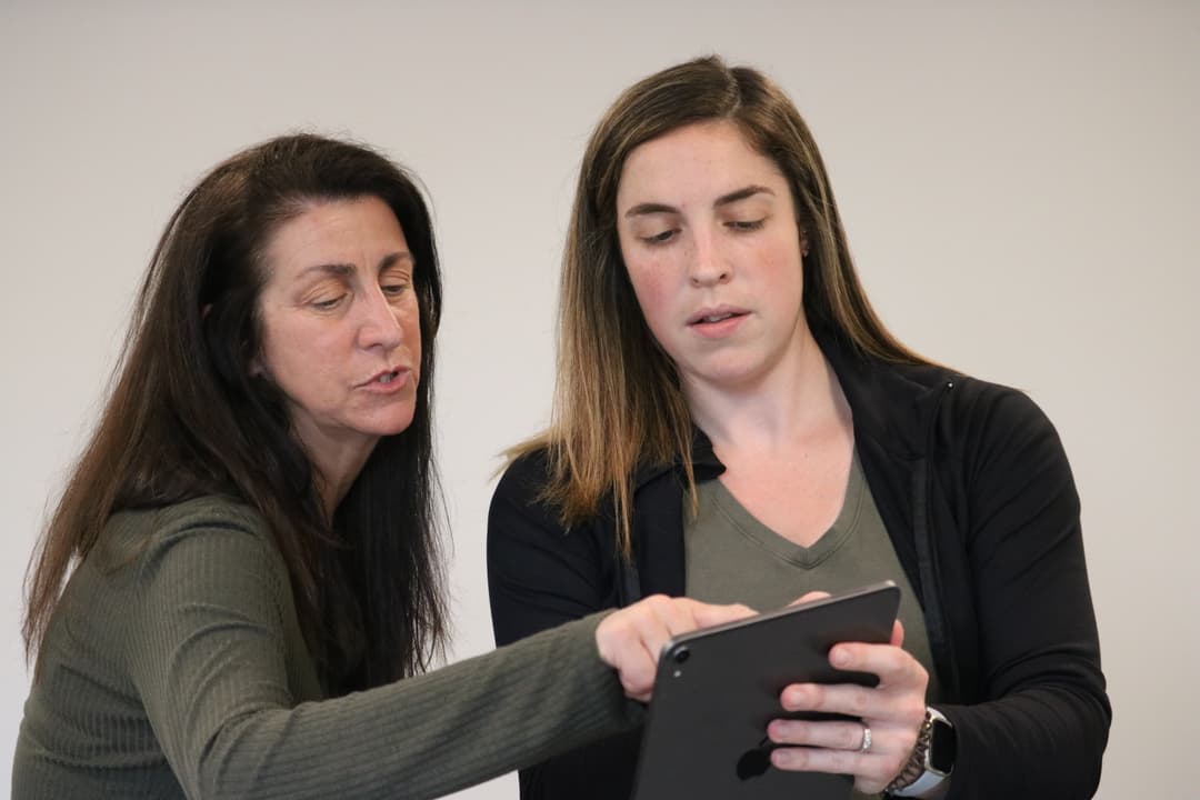 Heather looking at an iPad
